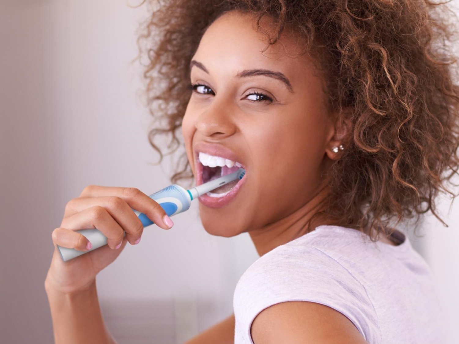 Woman brushing her teeth