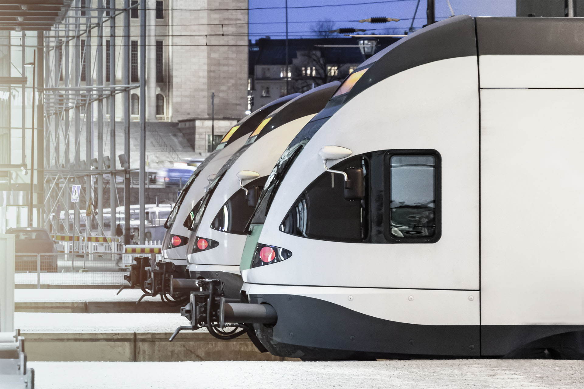 Three trains next to each other on tracks 