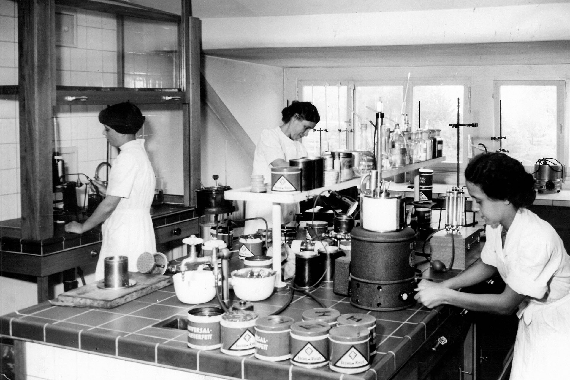 Old laboratory with three laboratory assistants 