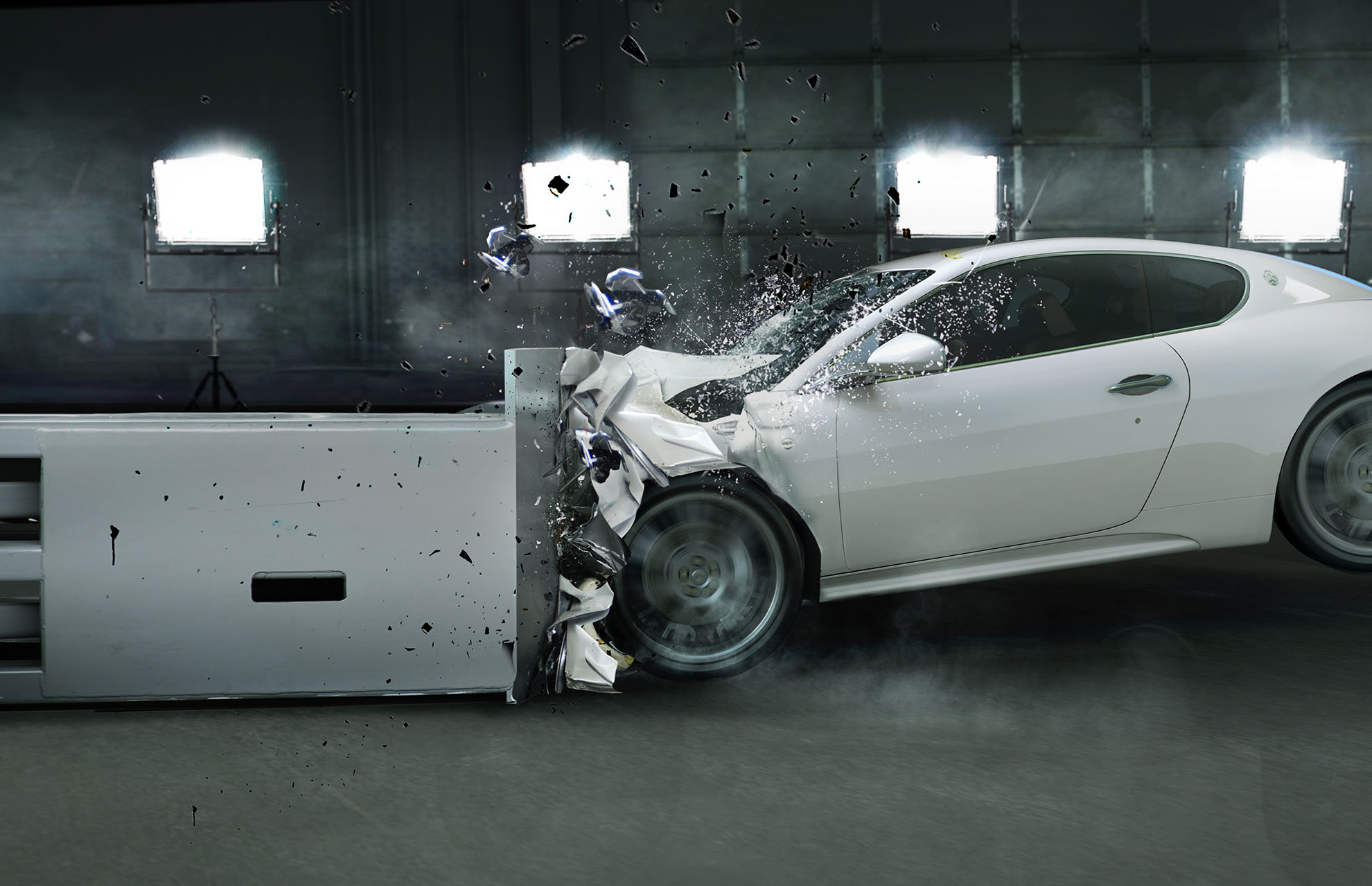 Car in crash test driving with the front into a buffer stop